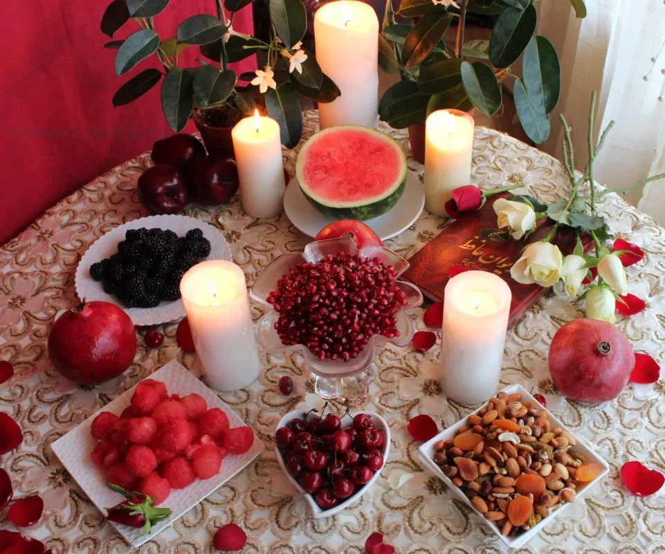 Traditional Sofreh Yalda with pomegranates and candles
